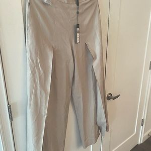 Bcbgmaxazria brand new with tags pants with split front. Size Medium